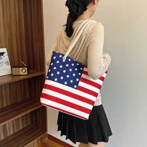 Stylish large canvas tote bag featuring an American flag design for 2026 fashion