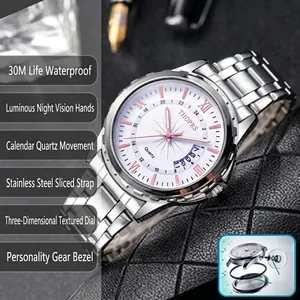 Close-up detail of silver stainless steel watch with luminous hands and date window