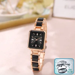 Detailed view of elegant square ladies quartz watch with rose gold and black link strap