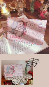 Detailed view of a vintage Santa Claus Christmas greeting card and envelope set