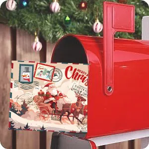 Vintage Christmas greeting card featuring Santa Claus in a festive red mailbox scene