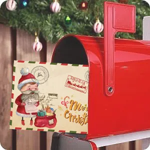 Close-up detail of a retro Kraft Christmas card with cartoon Santa inside a red mailbox