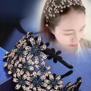 Detailed close-up showing the sparkling rhinestone flower headband worn by a model