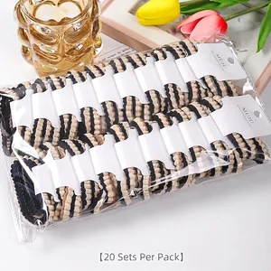 Bulk pack of 20 striped high-elasticity hair ties presented on white display cards.