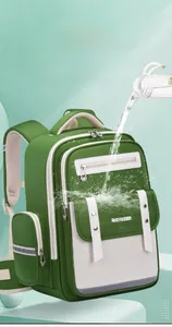 Water-resistant green and white children's school backpack for primary school students.