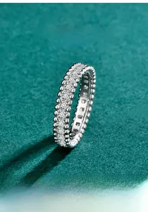 Macro detail shot of S925 sterling silver moissanite eternity ring with beaded edge