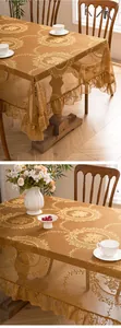 Close-up of golden lace tablecloth with elegant ruffles and floral embroidery details