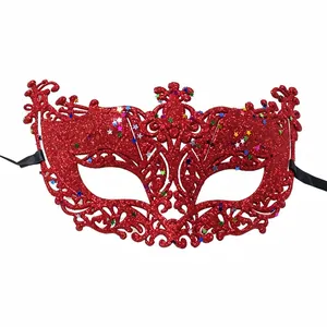 Detailed close-up of a red glitter filigree masquerade mask with star sequins.