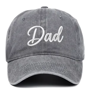 Close-up of vintage washed gray baseball cap featuring white Dad script embroidery detail.