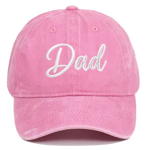 Detailed shot of pink washed cotton baseball cap with white embroidered Dad script