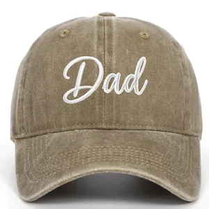 Close-up view of a vintage washed khaki baseball cap featuring white Dad embroidery