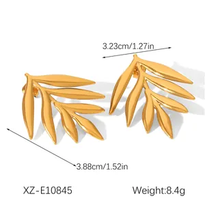 Close-up of 18K gold plated stainless steel leaf earrings with measurements and weight