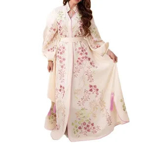 Robe longue élégante imprimée floral crème avec manches lanternes et détails de glands roses