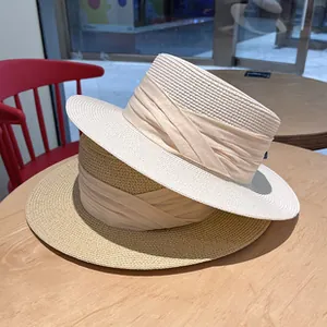 Elegant flat top straw sun hats for women, perfect for beach and summer style