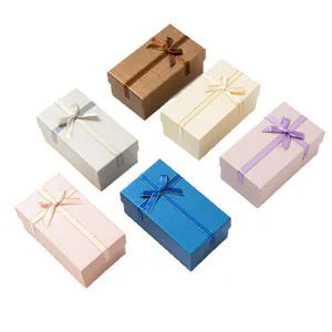 Elegant rectangular jewelry gift boxes with silk ribbon bows in multiple colors