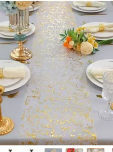 White mesh table runner with elegant gold foil star pattern for wedding banquet décor