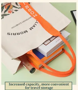 Detailed macro view showing the large capacity of William Morris canvas tote bag with books