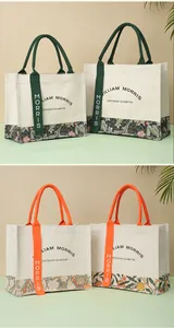 Detailed view of William Morris floral canvas tote bags with green and orange accents
