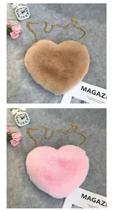 Detailed close-up of heart-shaped plush crossbody bags in pink and brown with gold chains