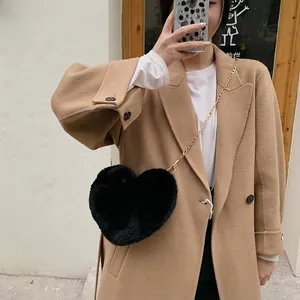 Fuzzy black heart-shaped plush crossbody bag with a delicate gold chain strap for women