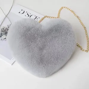 Cute grey faux fur heart-shaped crossbody bag with elegant golden chain shoulder strap