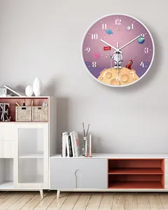 Modern astronaut wall clock displayed as a decorative piece in a minimalist interior