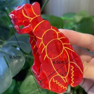 Vibrant red lobster shaped hair claw clip with yellow line details, 9.5cm length size