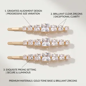 Detailed view of three gold-tone hair clips featuring gradated square clear zircons