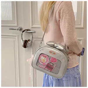 Silver PU leather ita bag with a clear heart window, bow detail, and pink ribbons