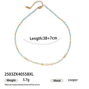 Detail view of turquoise beaded necklace with gold lobster clasp and extension chain