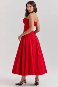 Macro detail of red corset bodice with structural boning and satin finish on dress