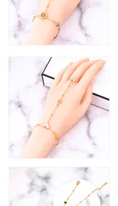 Detail of bohemian gold tree of life charm and heart link bracelet ring combo set