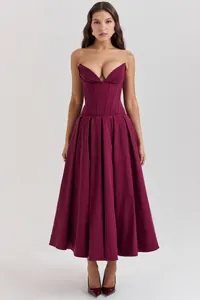 Macro detail of wine red corset bodice with V-neckline and boning structure