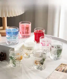 Close-up of dried flower scented jelly candles in aesthetic glass jars for home decor