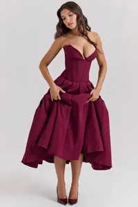 Detail of dark wine red corset dress with fishbone boning and plunging V-neckline