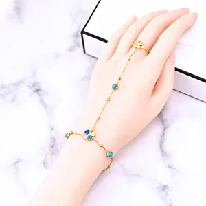 Elegant gold ring bracelet with tricolor clover pendants and blue turquoise beads