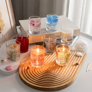 Macro view of transparent jelly scented candles with dried flowers and seashells