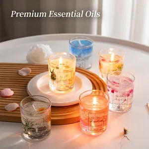 Handmade scented jelly candle set with dried flowers and gold leaf in glass cups