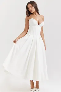 Close-up of white corset dress with supportive boning lines and elegant V-neckline detail