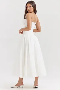 Detailed view of the white corset bodice with fishbone structure and flowing A-line skirt