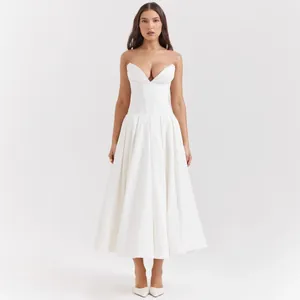 Close-up of elegant corset bodice with boning on white strapless midi formal dress