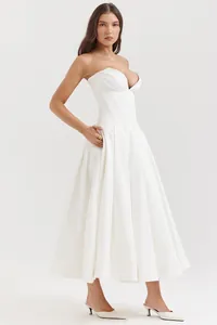 Detail of white corset midi dress featuring a deep V sweetheart neckline and flared skirt
