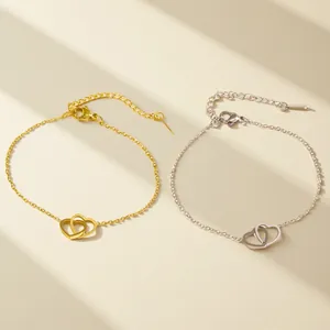 Elegant gold and silver double heart chain bracelet with adjustable clasp and shadows