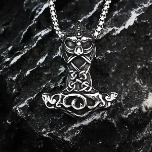 Detailed close-up of a vintage Thor's Hammer pendant with Viking Celtic knots