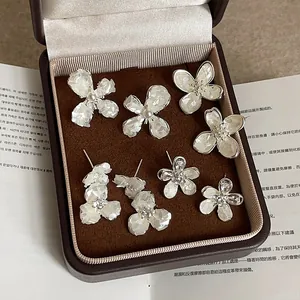 Elegant floral shell stud earring set with pearls and zircons in a velvet gift box