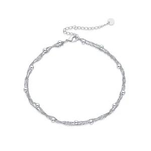 Detail of 18K gold plated multi-strand water ripple chain with beads and lobster clasp