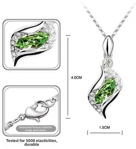 Detail of S-shaped pendant with marquise green crystal and lobster clasp necklace