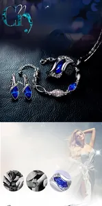 Detail of luxury jewelry set with marquise blue crystals and silver-tone finish