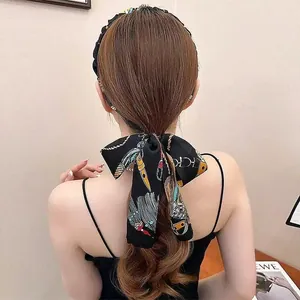 Vintage palace style silk scarf headband with an elegant bow and floral pattern design