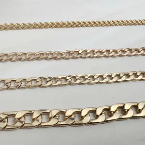 Detailed view of four different widths of golden curb link chains for anklets